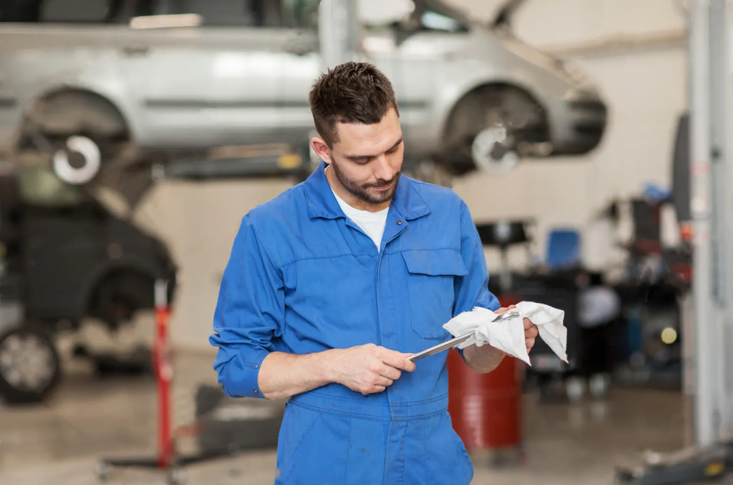 stock-photo-car-service-repair-maintenance-and-people-concept-auto-mechanic-man-or-smith-with-wrench-at-4948601021